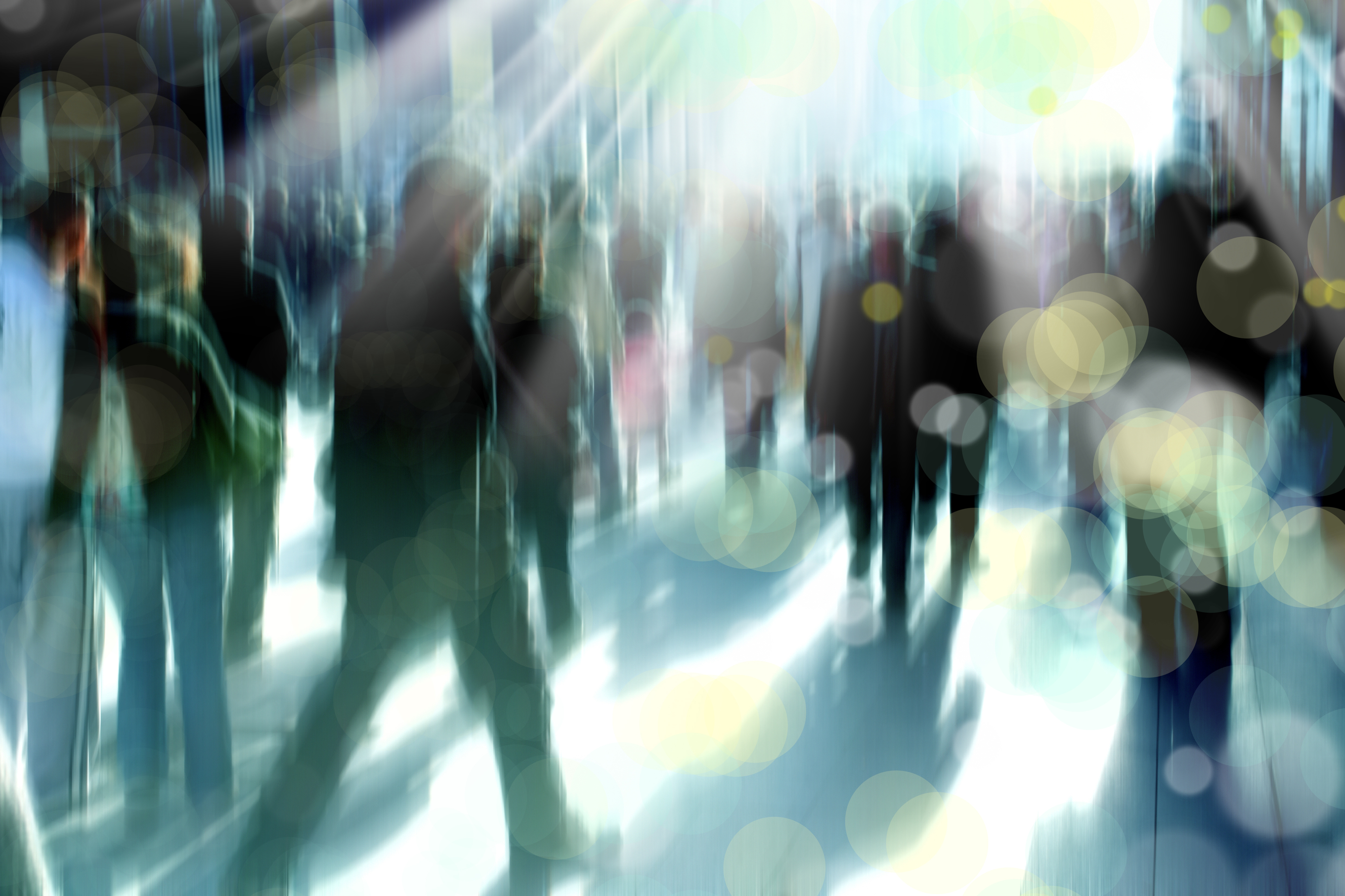 blurry background image of people walking on busy street