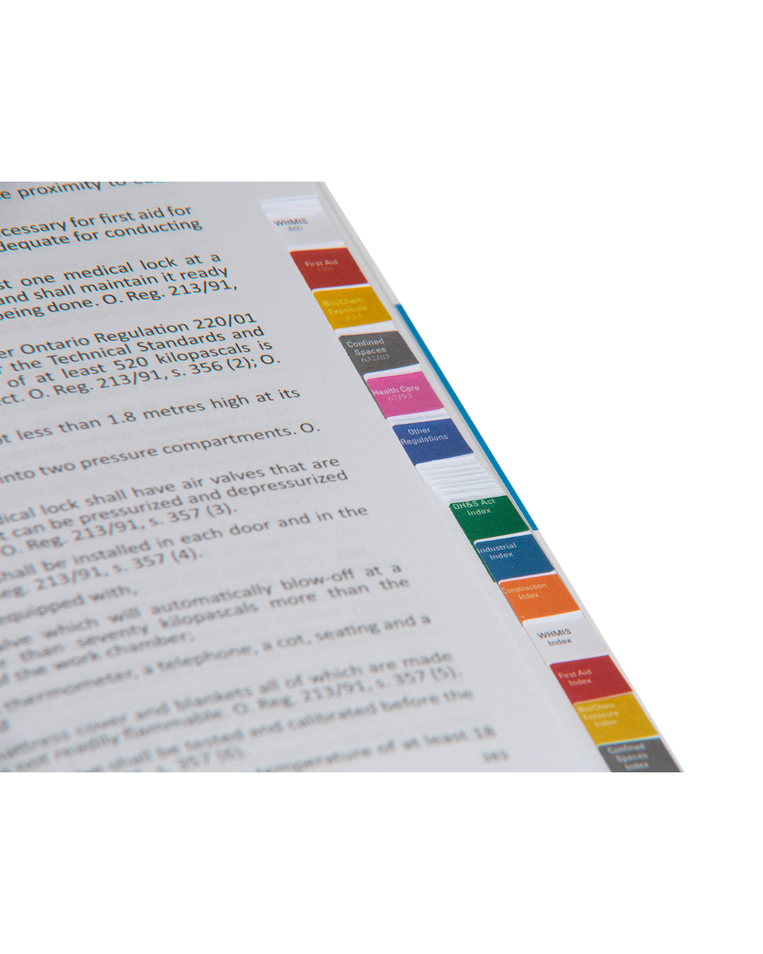 Inside the OSG Green Book with colour-coded tabs for OHSA regulations